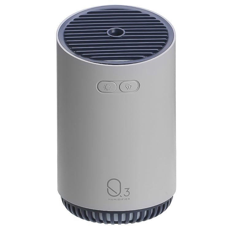 Gray mini humidifier with top air vents and circular indicator, compact countertop device.