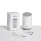 Mini humidifier with power cord, instruction sheets, and retail box, light gray device.