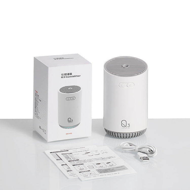 Mini humidifier with power cord, instruction sheets, and retail box, light gray device.