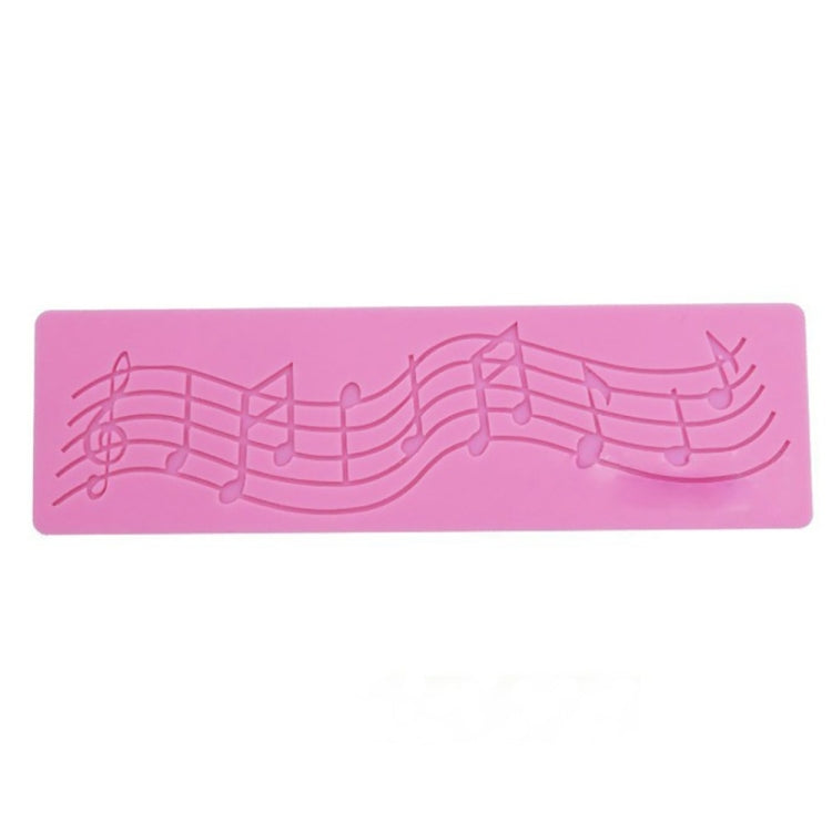 Pink silicone music-note cake fondant mold with embossed musical staff pattern