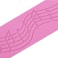 Close-up of pink silicone music-note fondant mold with embossed curved staff lines