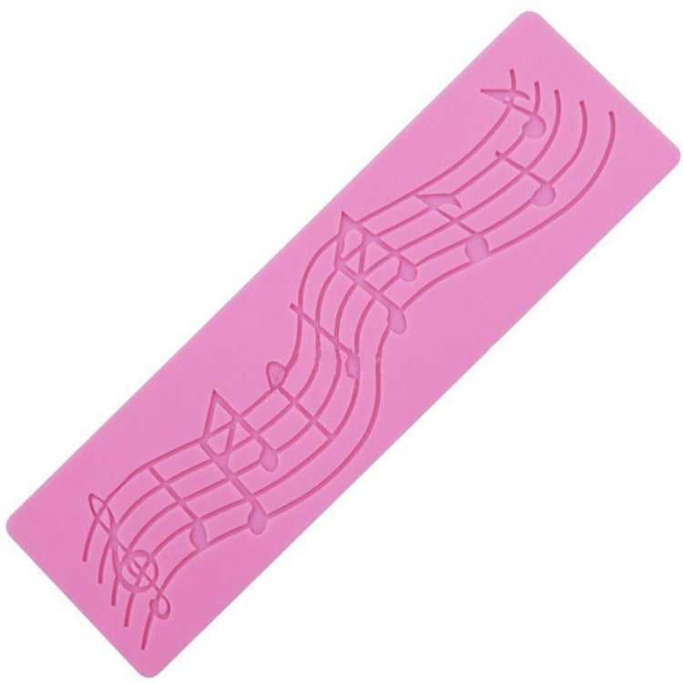 Pink silicone music-note fondant mold with embossed treble staff and notes