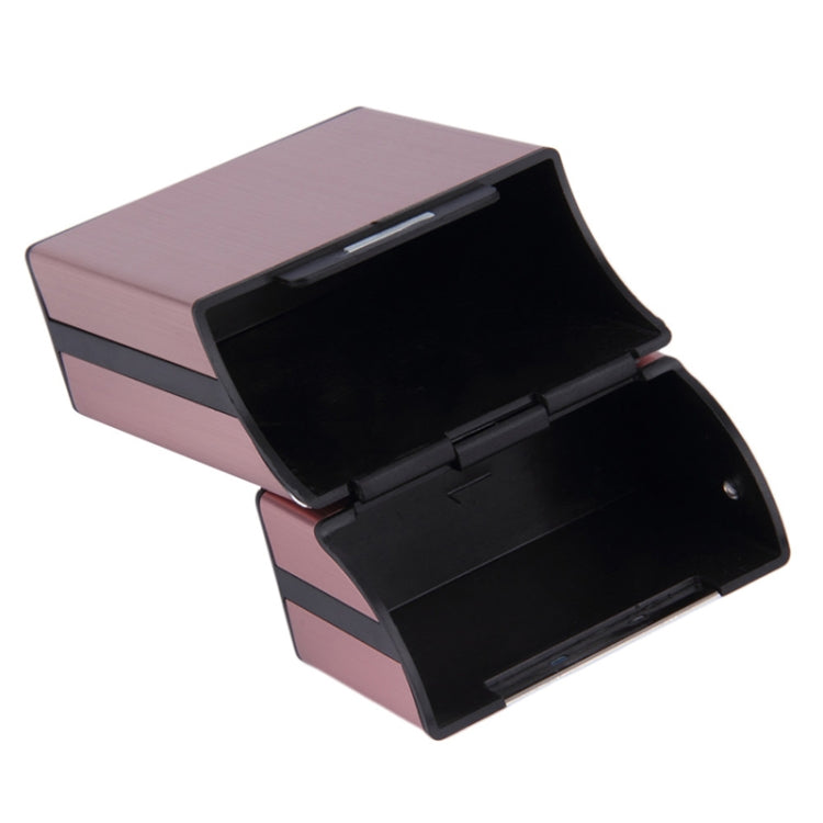 Pink aluminum cigar case with lid opened to reveal black inner compartments