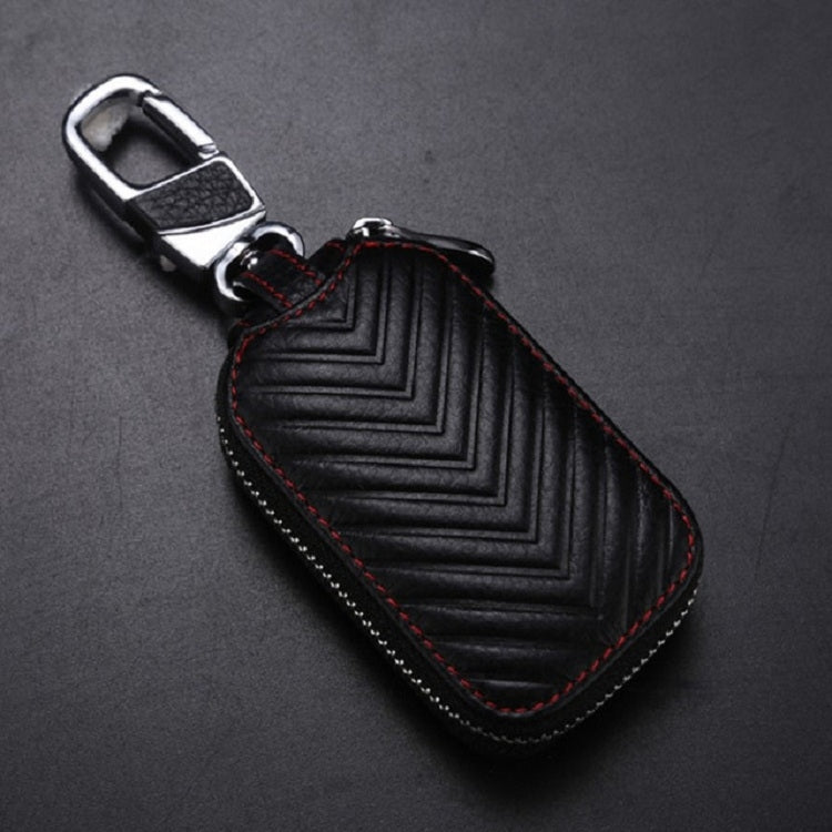 Black leather key pouch with top metal clip, red trim stitching, zigzag pattern, zipper