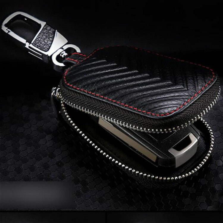 Black leather key pouch with front zipper, metal carabiner clip, red contrast stitching