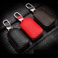 Set of three leather key pouches: black, brown, and red, with metal clips and zippers