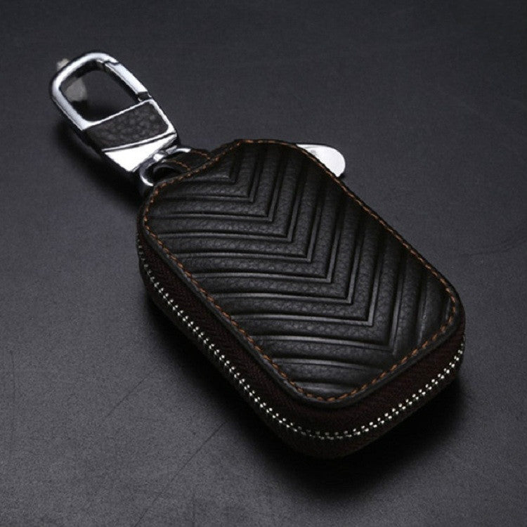 Brown leather key pouch with metal clip, contrast stitching, zigzag embossing, zipper