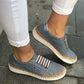 Blue breathable slip-on flats sneakers with perforated upper and striped side detail