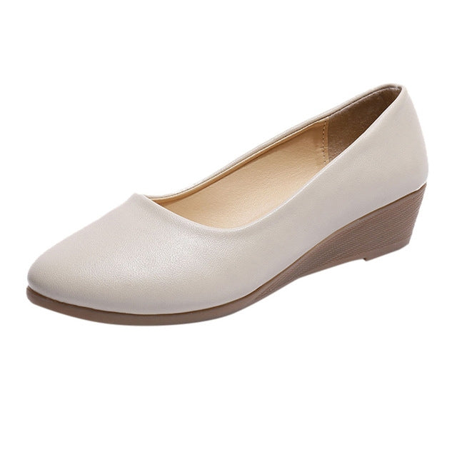Light beige wedge women’s shoes with round toe and low stacked heel