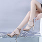 Silver peep-toe high heel sandals with star detailing and ankle strap on high stiletto