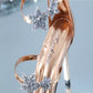 Champagne metallic high heel sandal with star embellishment on peep toe and clear strap