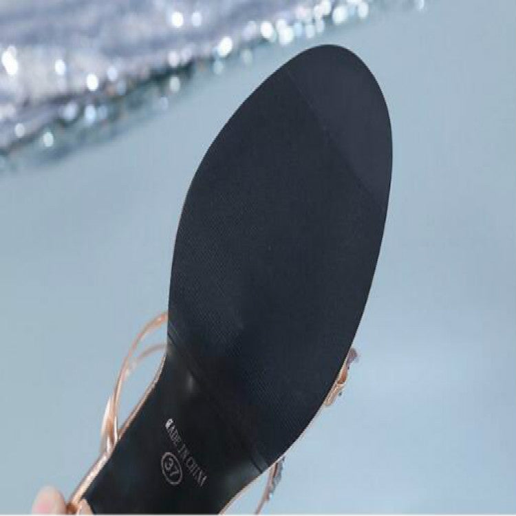 Black high heel sandal sole with peep-toe strap and star-adorned upper