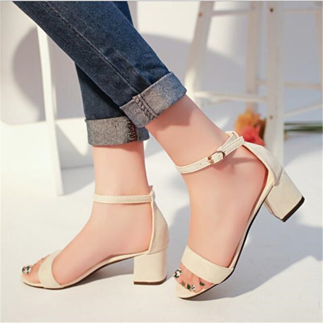 Beige open-toe sandals with ankle strap and low block heel