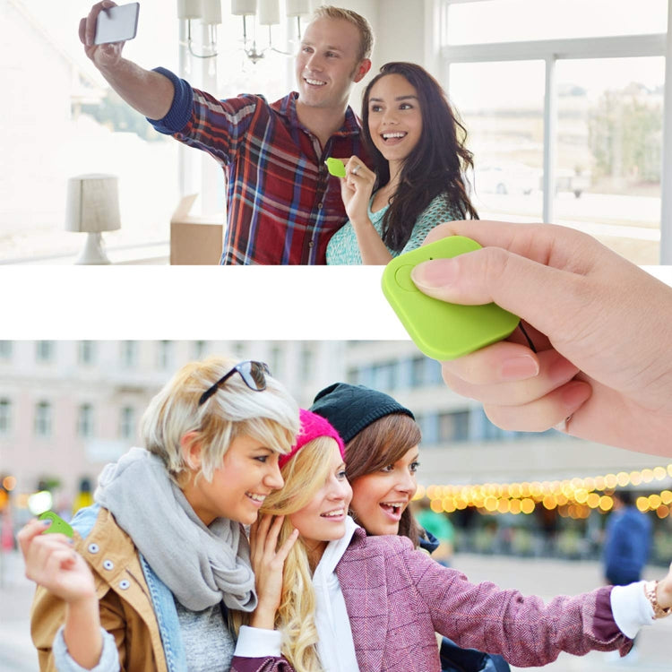 Green mini square Bluetooth key finder alarm tracker held in a hand.