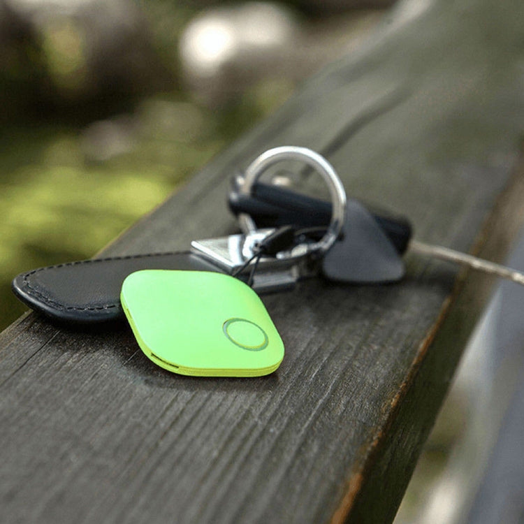 Green mini square Bluetooth key finder alarm tracker on a keyring with round button.