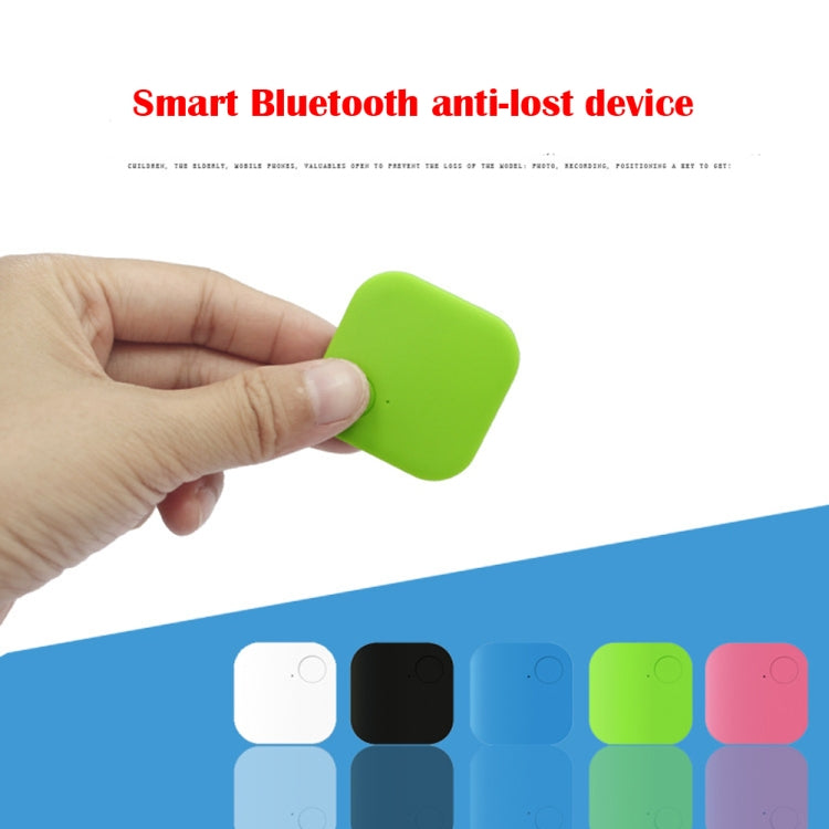 Green square Bluetooth anti-lost tracker held in hand; round button visible.