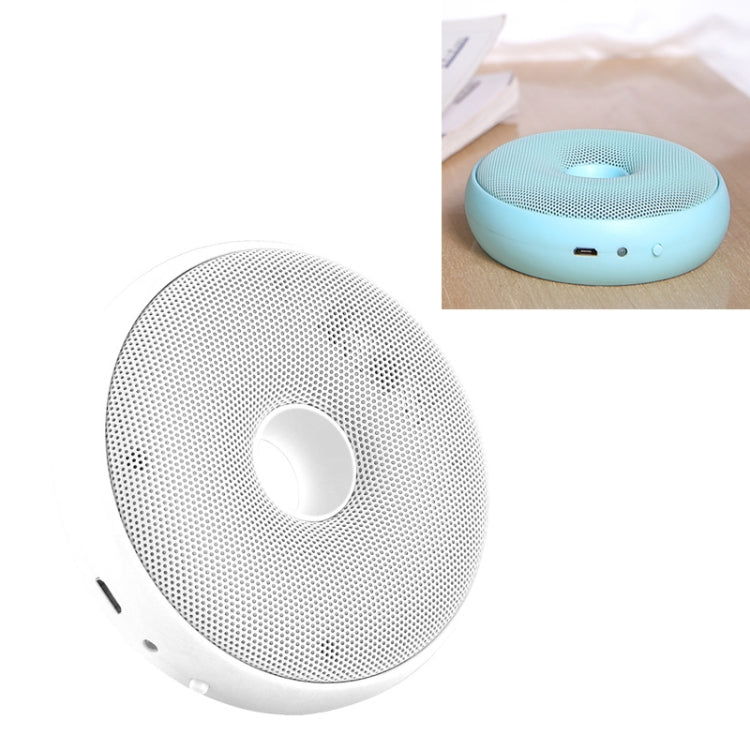 White portable air purifier with perforated top and central circular vent