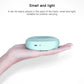 Turquoise portable air purifier with perforated top and front indicator buttons in hand