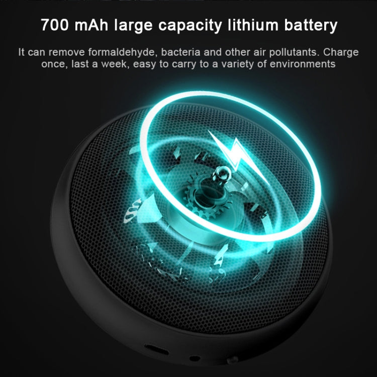 Black portable air purifier with glowing light ring around the circular grille