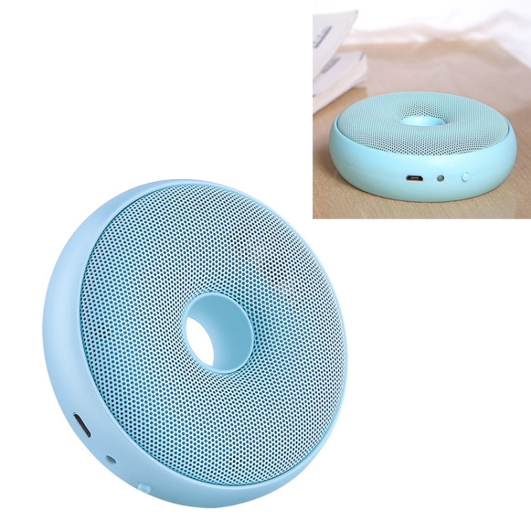 Blue portable air purifier with circular grille and central ring opening.