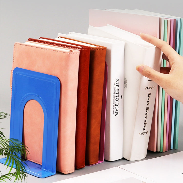 Assorted color metal bookends with U-shaped openings holding books upright