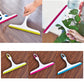 Set of colorful glass wiper squeegees with white handles and curved rubber edges