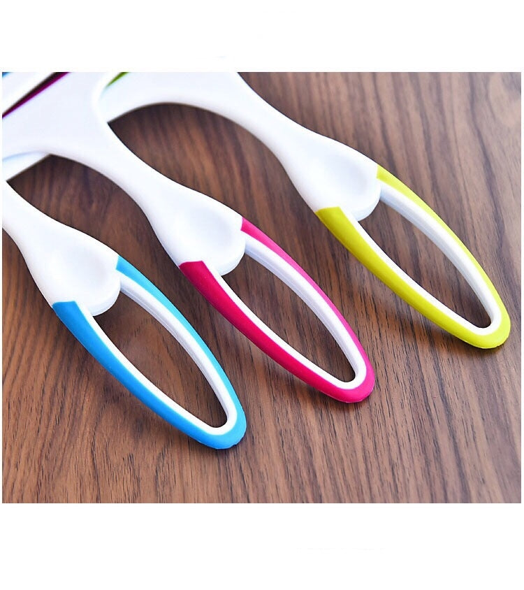 Colorful glass window squeegee wipers with white handles and curved rubber edges