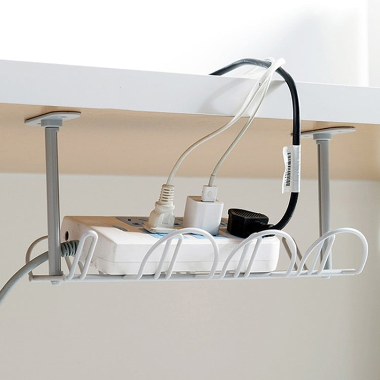 White under-desk cable rack organizer with adapters and bundled charging cords