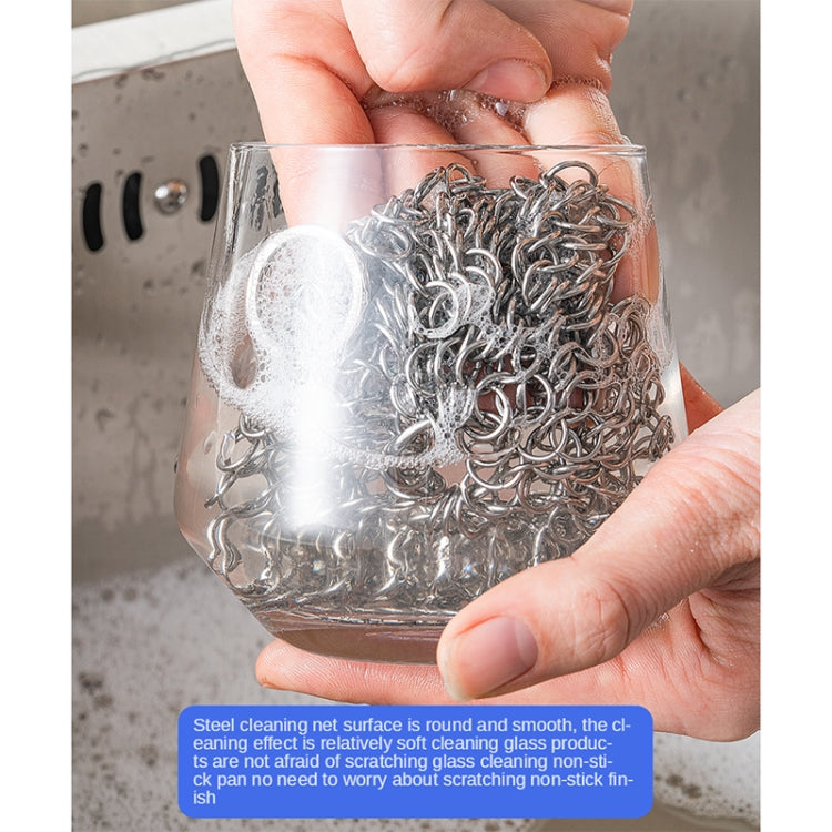 Stainless steel scrubber net used on a glass tumbler, chain mesh surface