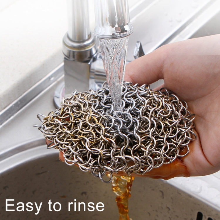 Square stainless steel scrubber net rinsed under sink water with ring loop