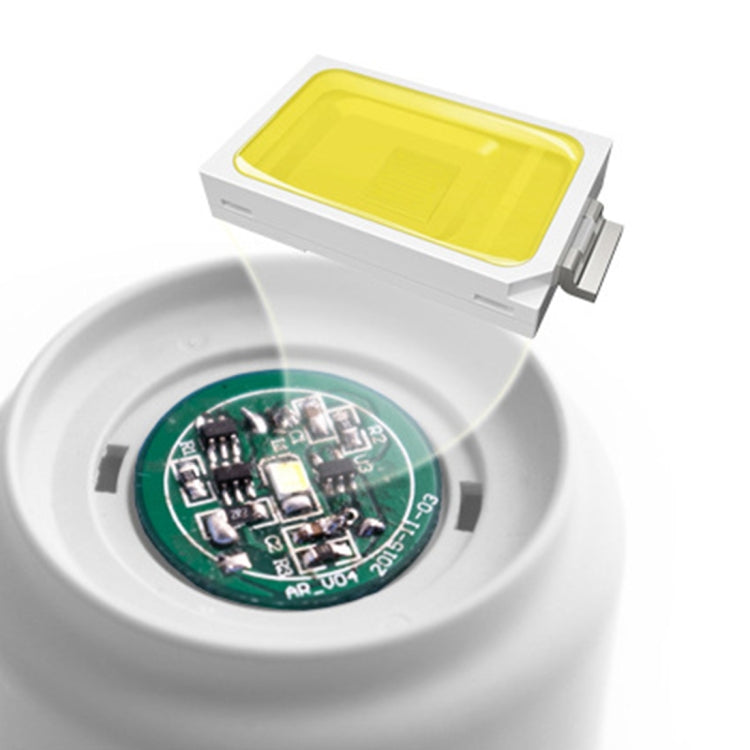 USB night light charging module with circuit board and yellow display window in white base