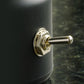 Black night light base with metal charging switch knob, close-up detail