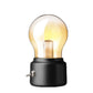 Black USB bedside night light with glowing vintage bulb and cylindrical base with side knob