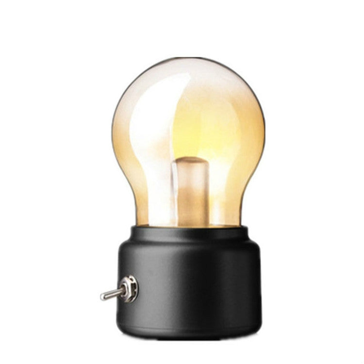Black USB bedside night light with glowing vintage bulb and cylindrical base with side knob
