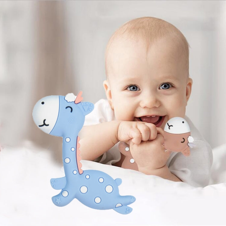 Blue fawn-shaped silicone teether with doe-face ends, held by a smiling baby