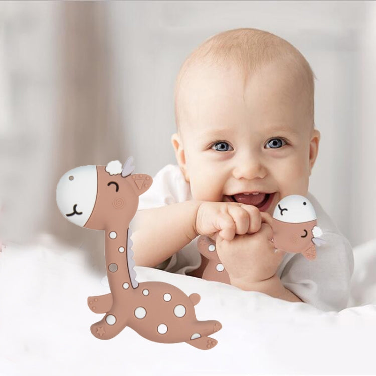 Brown fawn-shaped silicone teether with doe-face ends, in a baby's hand