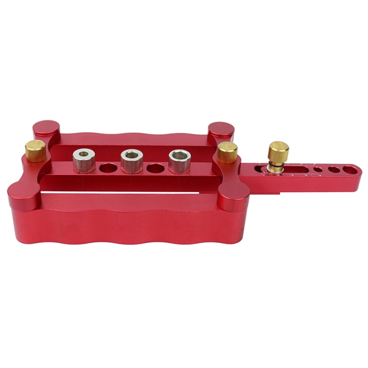 Red vertical triple-hole dowel locating punch with metal guide bushings and pins