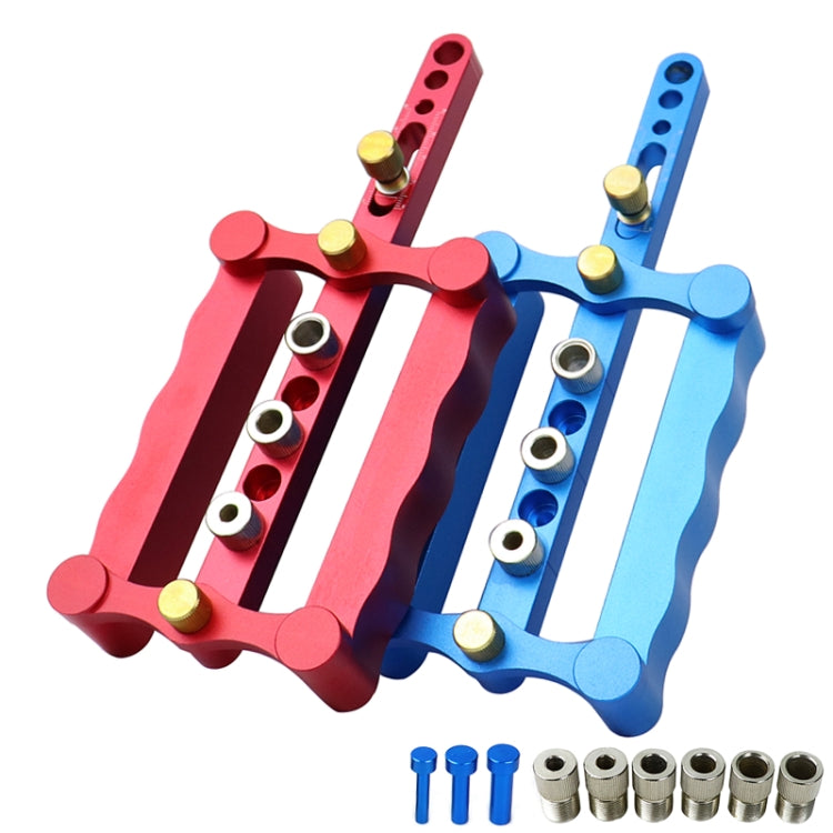 Red and blue vertical triple-hole dowel locator set with metal guide bushings and pins