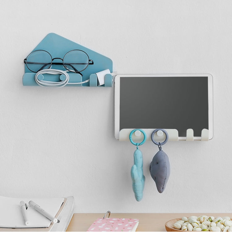 Wall-mounted phone holder with hooks, teal-blue base holding keys and glasses