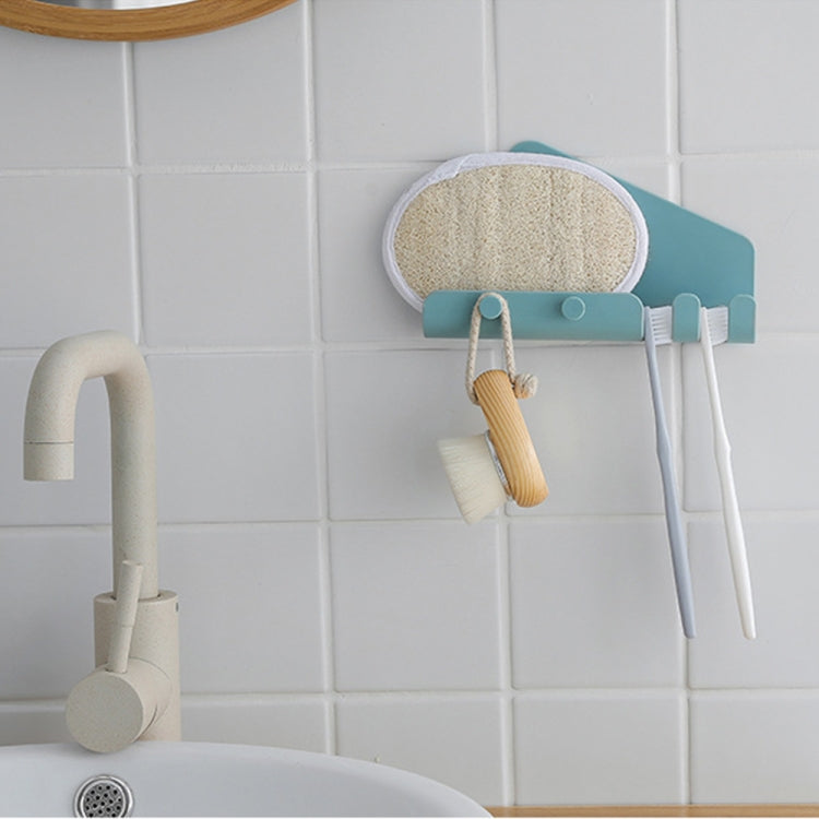 Wall-mounted phone holder with hooks, teal-blue tray holding a phone charger cord