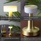 LED table lamp with gold metal base and white cylindrical shade