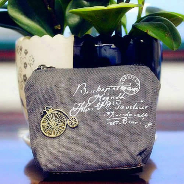 Gray mini coin purse with zipper, vintage script print and bicycle charm front