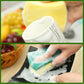 Hand scrubbing with a green-and-yellow scouring sponge eraser on a baking dish