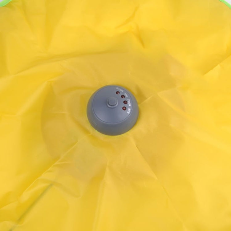 Close-up of yellow fabric cat playing mat with gray dome motor control panel