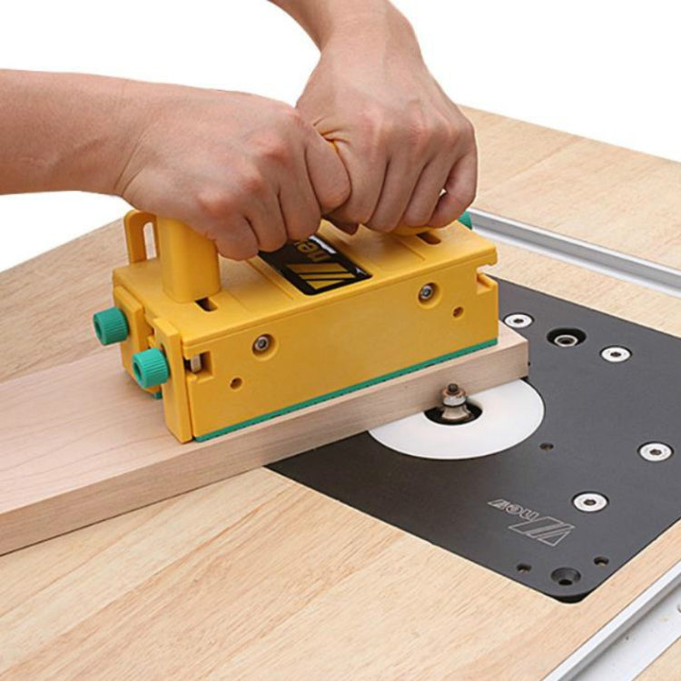 Yellow push handle jig with base plate and teal adjustment knobs