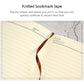 A5 notebook with knitted bookmark tape attached inside