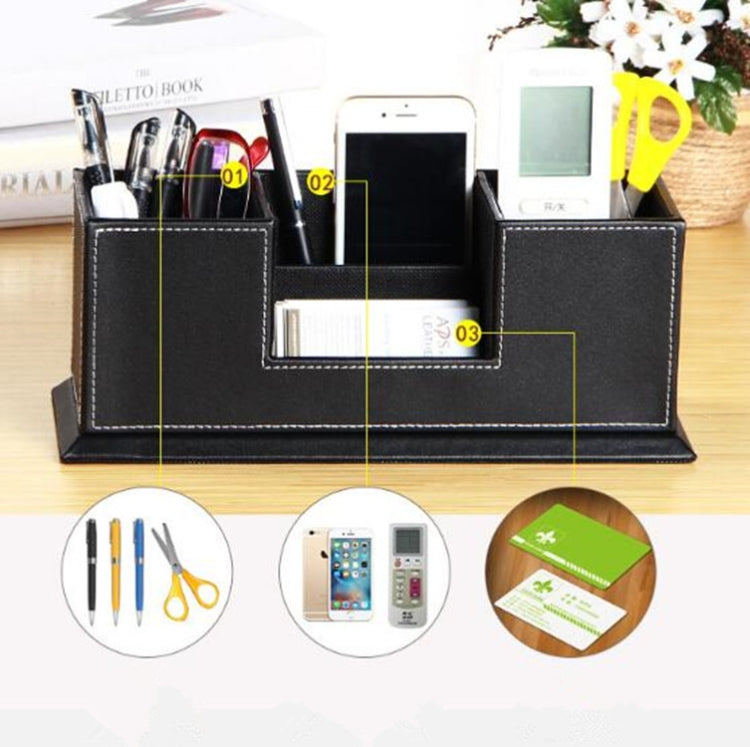 Black leather desktop pen holder with five compartments and labeled storage sections