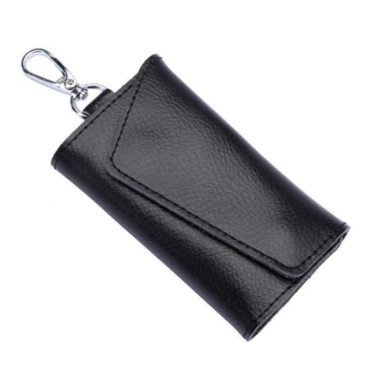Black leather keychain pouch with stitched snap flap and metal keyring, litchi texture.