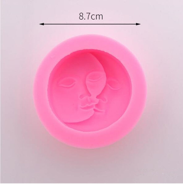 Pink silicone face mold with embossed smiling baby face relief inside.