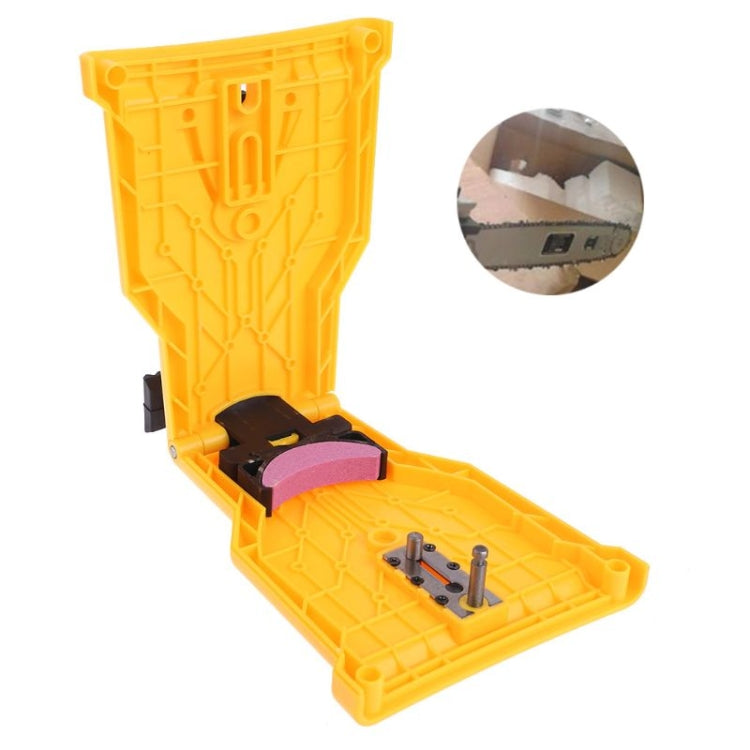 Opened yellow chainsaw chain sharpener case with purple abrasive pad and pins